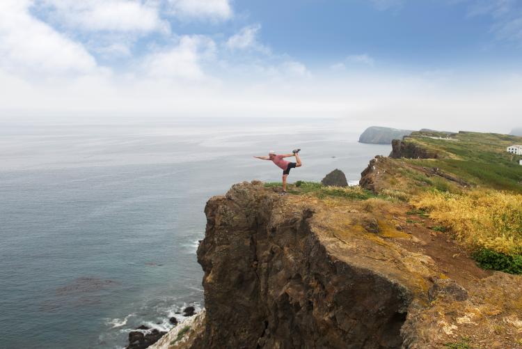 dancer's pose island cliff